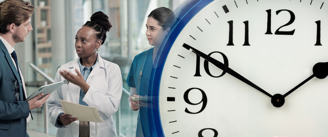 Composite image showing 3 medical staff in conversation and an a large clock set at 10 minutes to 2.